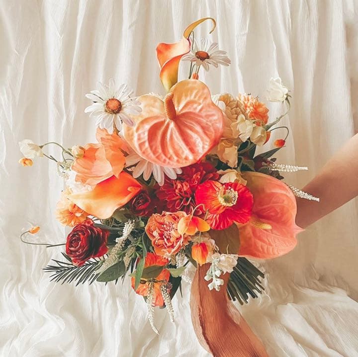 鮮やかな色合いオレンジ黄色ラウンドブーケウェディングブーケ.jp